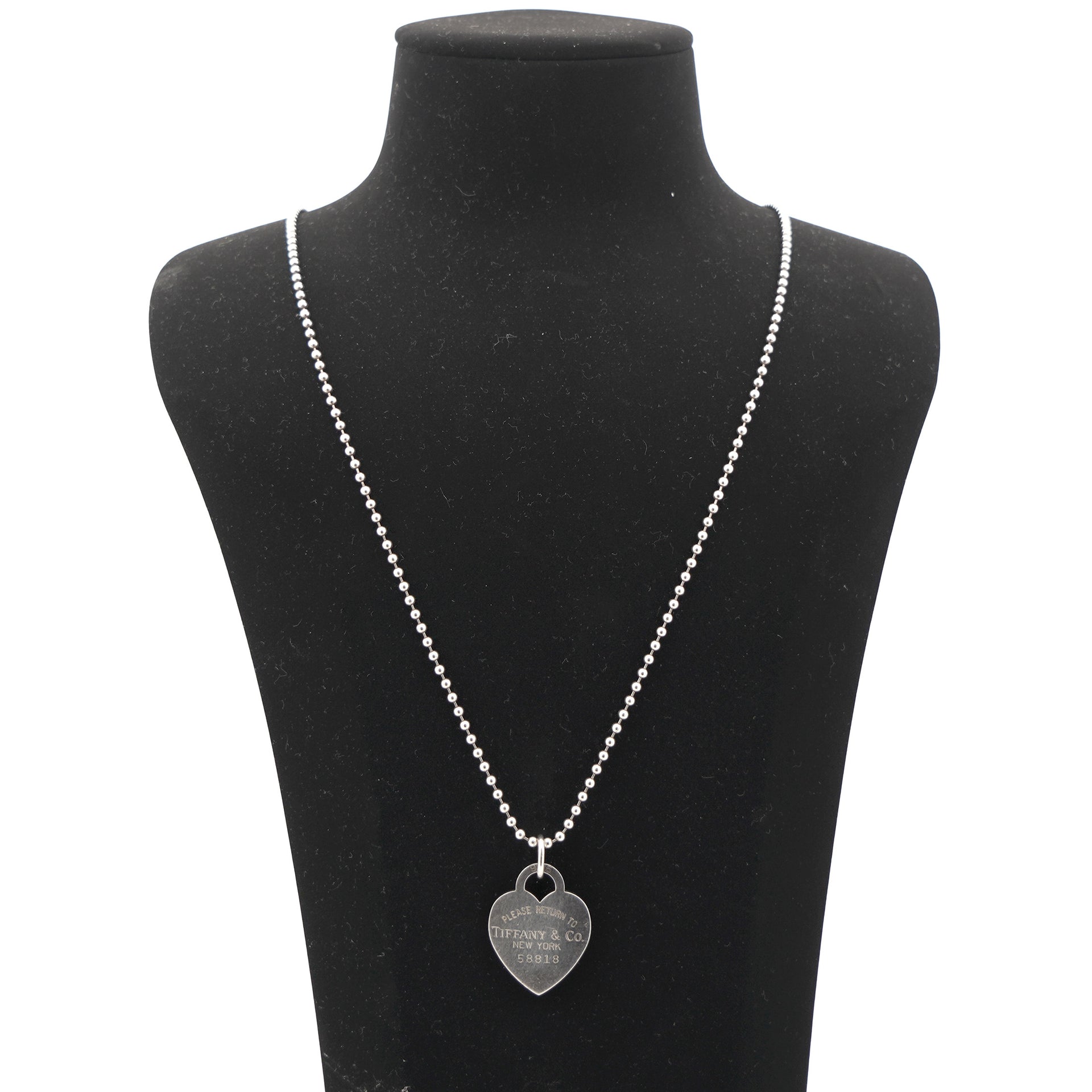 Elsa Peretti® cross pendant in sterling silver, 12 mm long. | Tiffany & Co.
